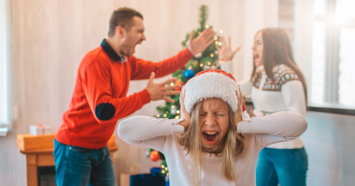 couple arguing in front of child at Christmas