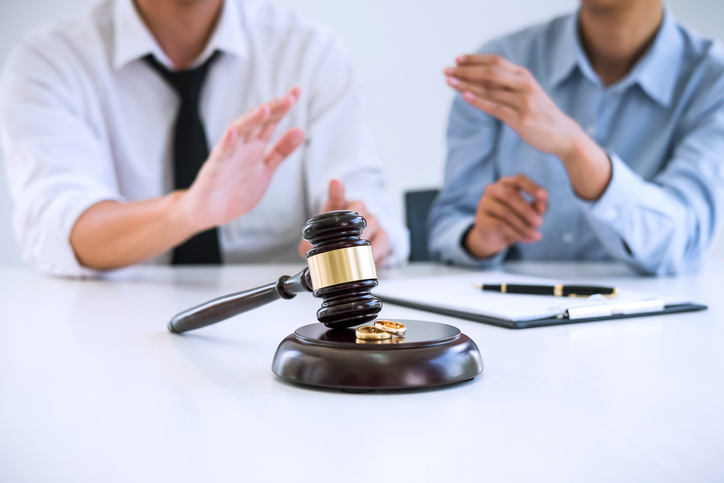 divorcing couple arguing in a law office