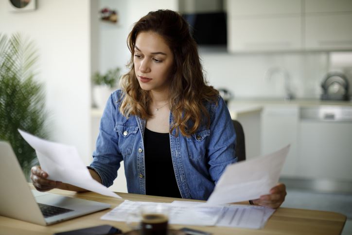 woman reviewing papers