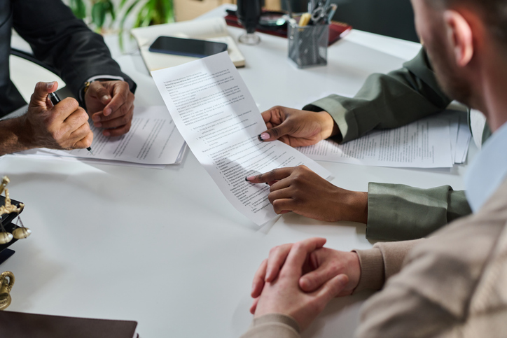 couple going over documents in lawyer's office
