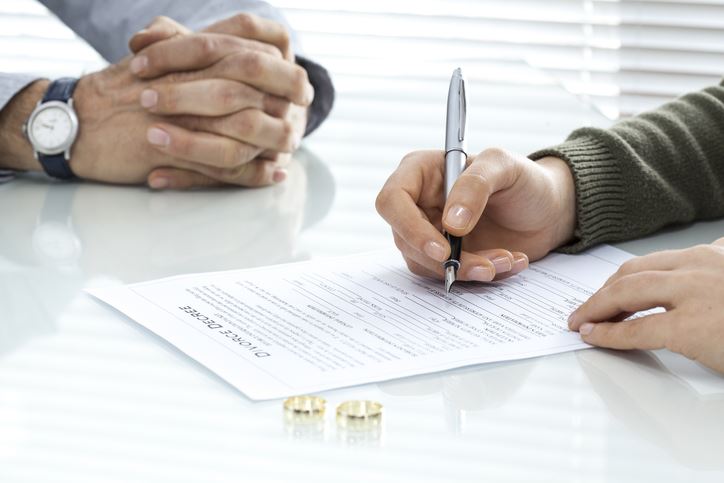 divorcing couple signing papers