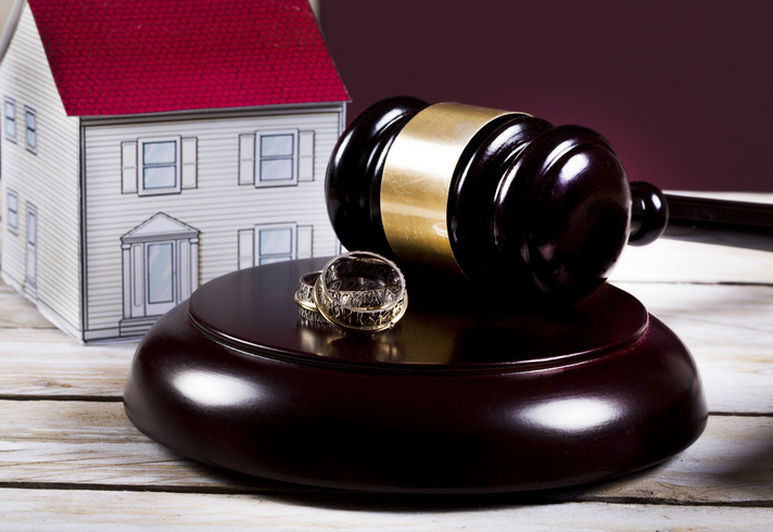 house model, wedding rings, and gavel