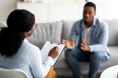 man meeting with a therapist